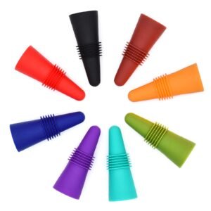 Colorful silicone wine bottle stoppers arranged in a circle on a white background