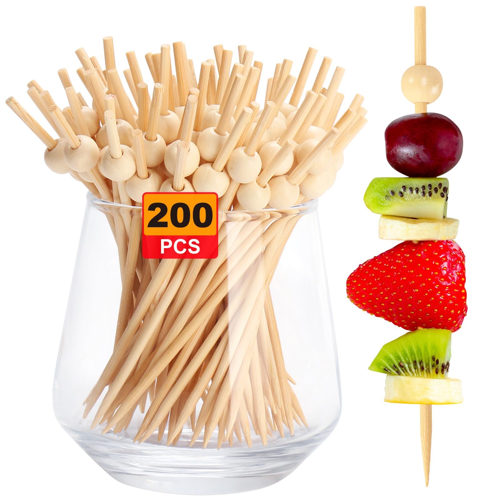 Wooden skewers with fruit kabob and a glass of toothpicks