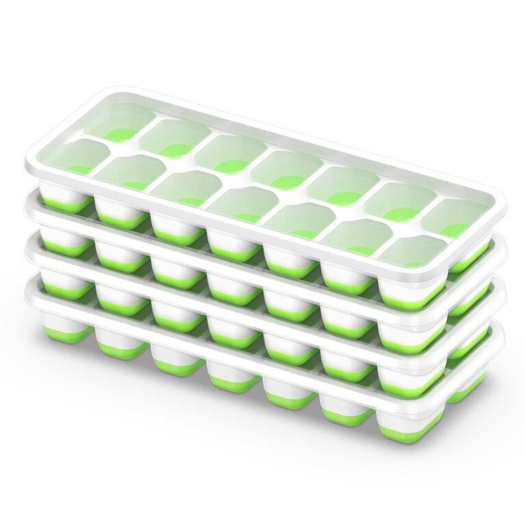 Stack of three white and green ice cube trays