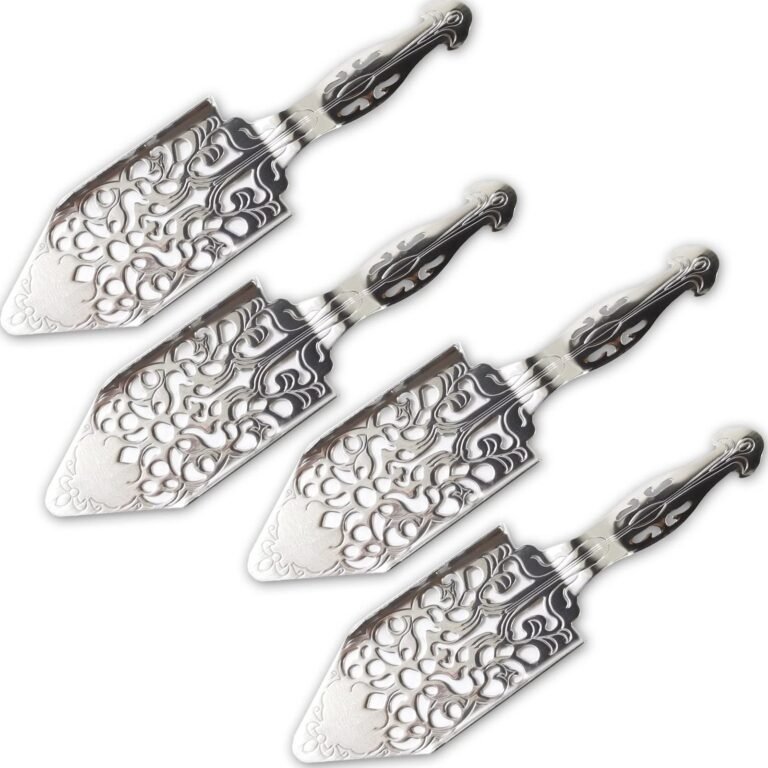 Four ornate silver absinthe spoons with decorative handles and blades