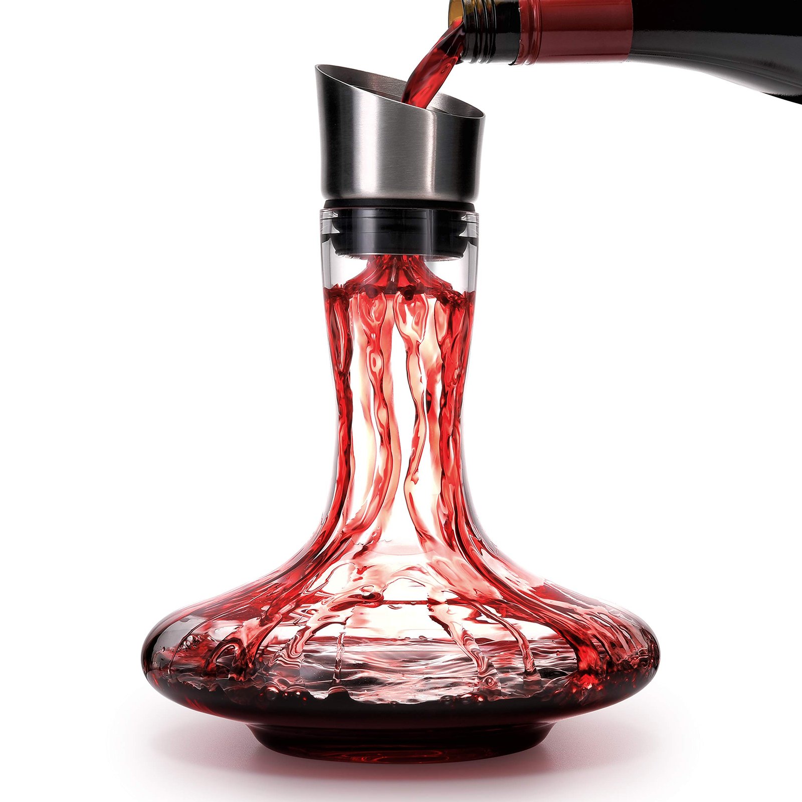 Red wine pouring into a glass decanter with a stainless steel aerator